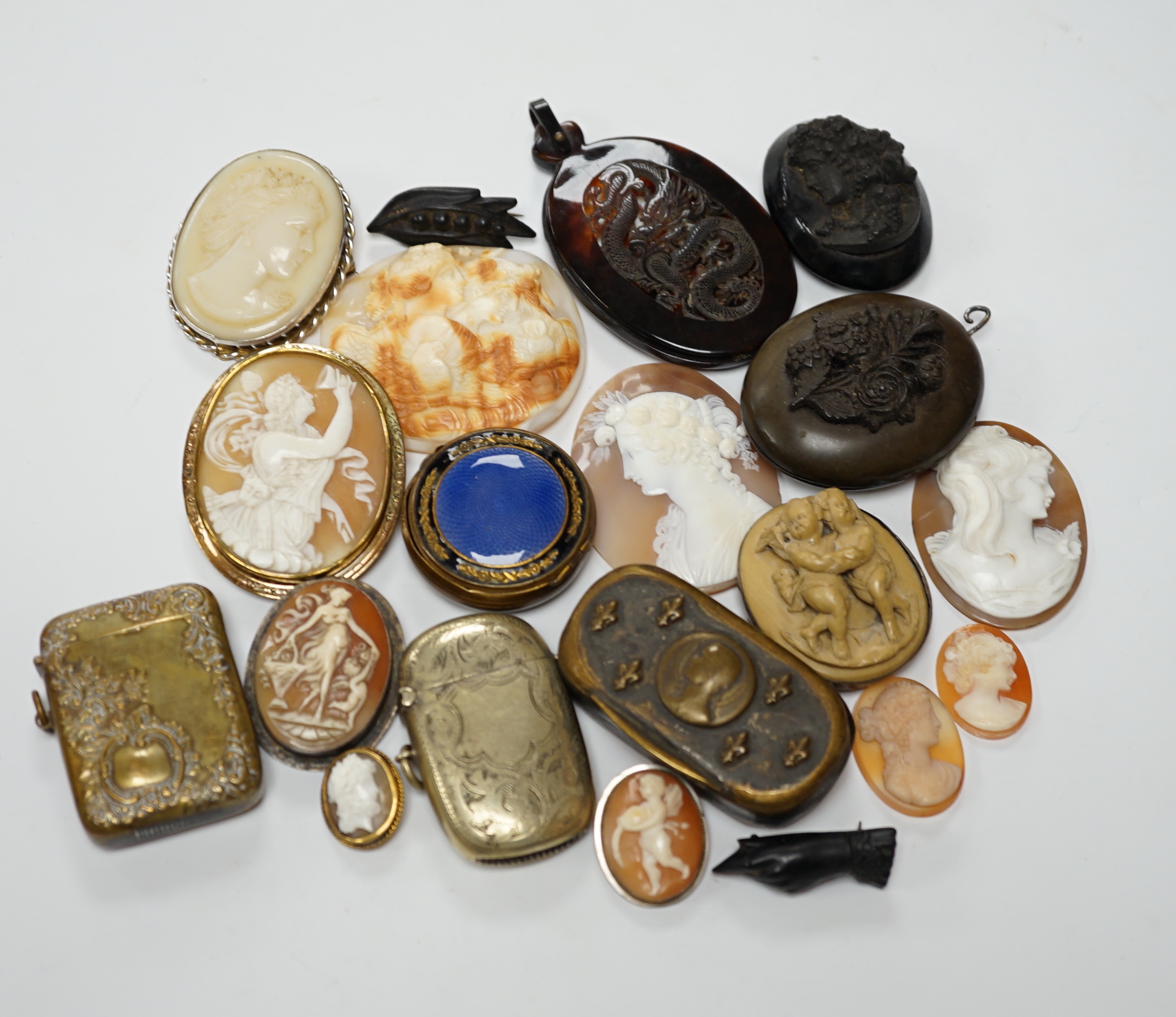 Five assorted unmounted carved cameo shells, largest 57mm, four other mounted cameo brooches including three shell, two base metal vestas and a box and sundry other items.